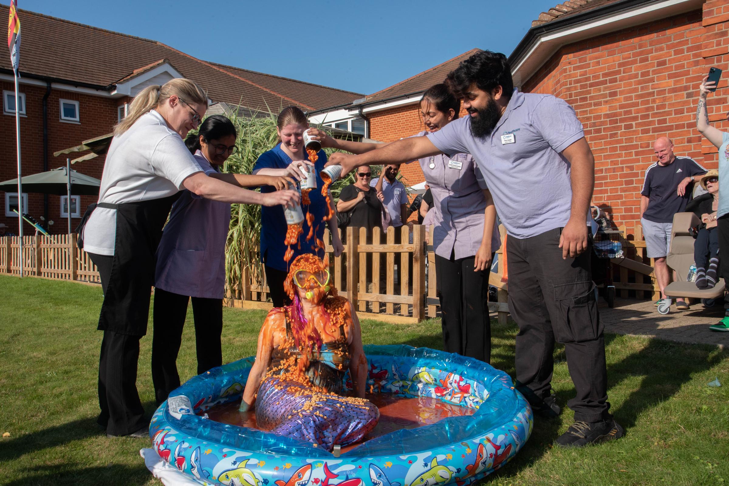 Bean there done that! Health worker retires in style with baked bean bath challenge